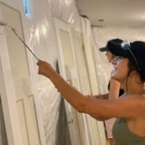 Woman painting door