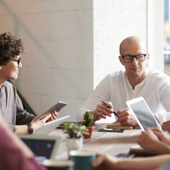 Employees sitting around a table planning