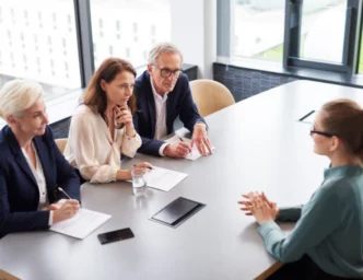 people sitting around an interview table