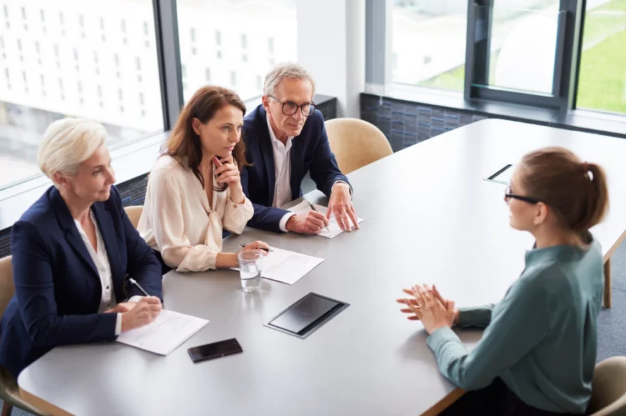 people sitting around an interview table
