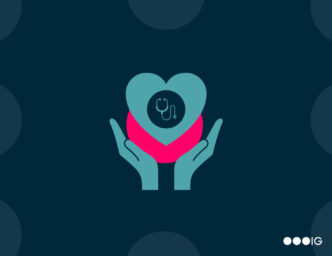 hands holding heart with healthcare device