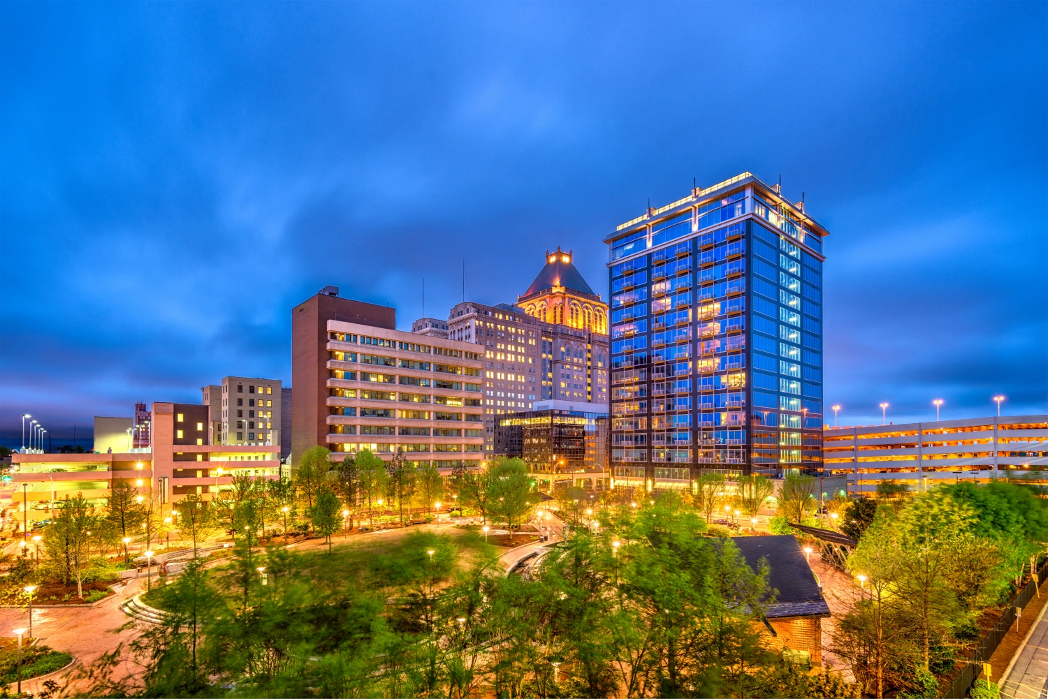 A park in Greensboro, North Carolina with the city's skyline in the background.