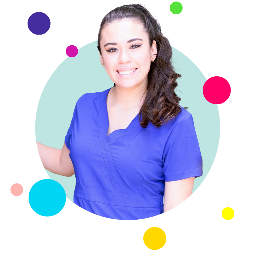 A young woman in purple scrubs that's a phlebotomist.