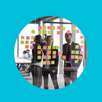 Blue background with round cutout showing three scrum masters working on a project with sticky notes planning Hiring a Scrum Master
