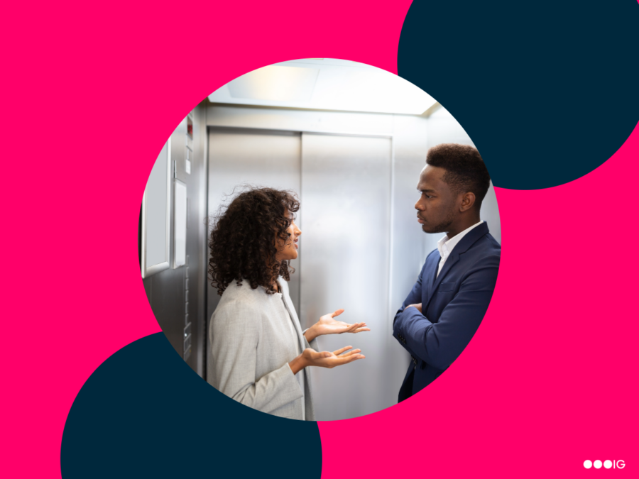 two people in elevator discussing how to create an elevator pitch.